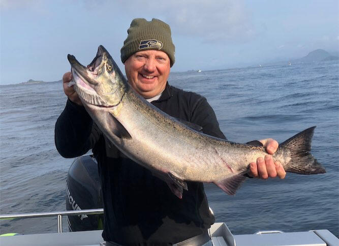 Guest holds salmon